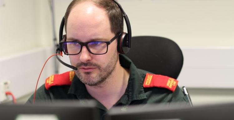 Ambulance worker taking calls with a headset. 