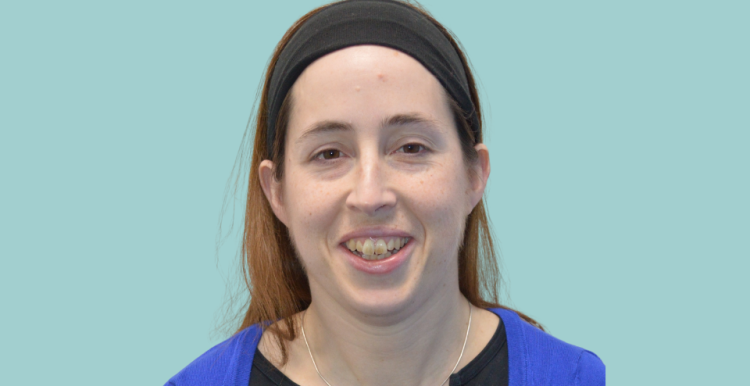 A photo of a Healthwatch volunteer against a blue backdrop.