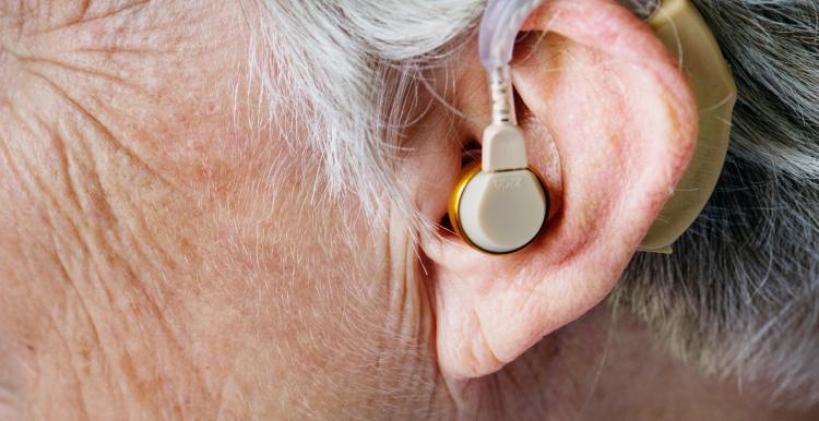 close up of hearing aid in an older person's ear