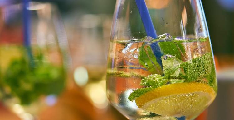 Close up show, Wine Glass, Blue Straw, Mint, Ice, Spirit, Blurred Background