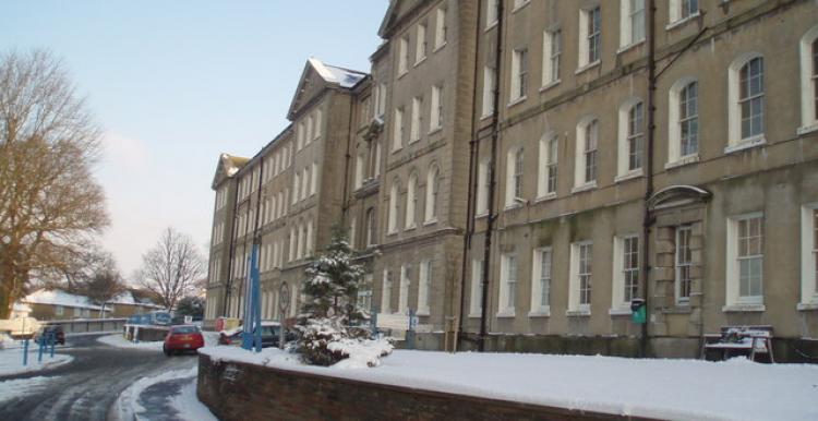 Front view of Brighton General, Snow Covers foreground and building