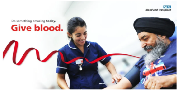 NHS Give Blood Poster, Nurse Smiling, Man Sitting Smiling Ready to Give Blood, Red Ribbon across Poster