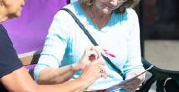 Two women looking at a document