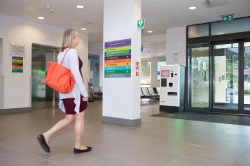 Woman walking in hospital.