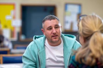 A man talking to a woman