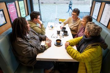 Several women socialising.